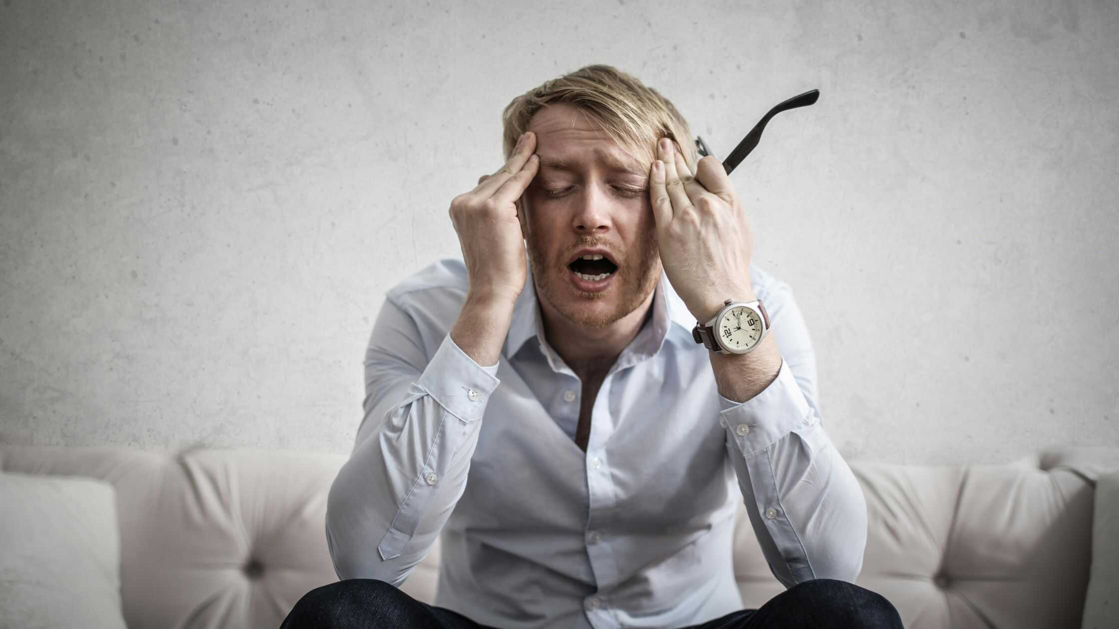 Photo Of Man Touching His Head